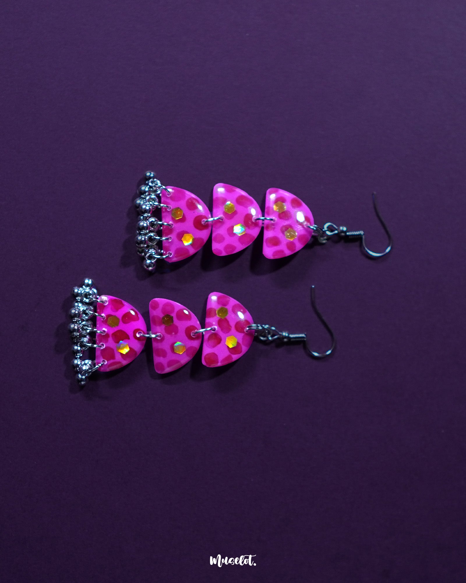 Parvaaz pink drop earrings adorned with soft floral detailing in blush tones and leafy accents, highlighting the handcrafted charm and showcasing the perfect blend of femininity and elegance — Muselot.