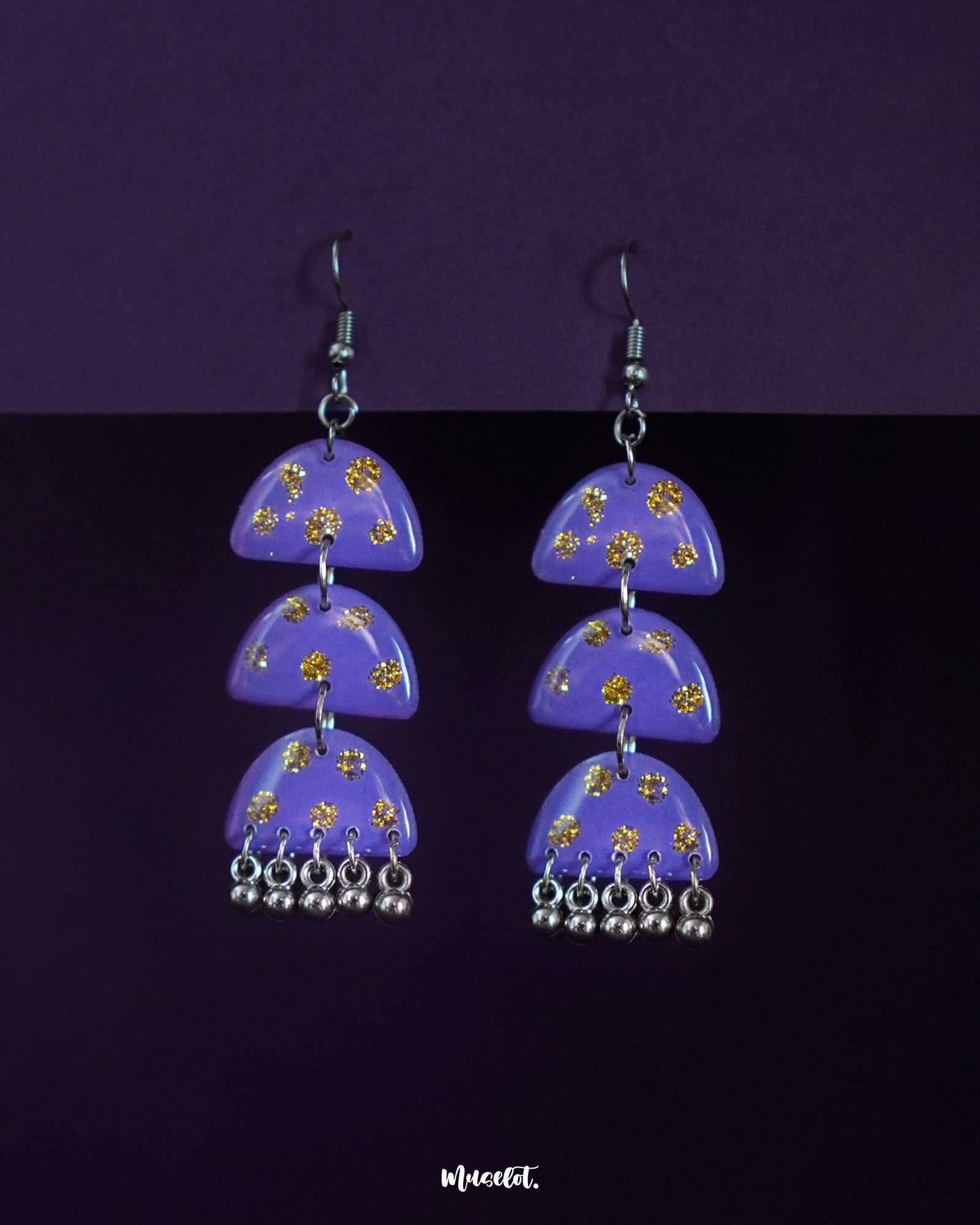 Parvaaz purple drop earrings featuring delicate patterns and a graceful curved silhouette, highlighting their handcrafted detail and showcasing a soft yet striking statement accessory — Muselot.