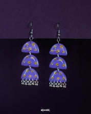 Parvaaz purple drop earrings featuring delicate patterns and a graceful curved silhouette, highlighting their handcrafted detail and showcasing a soft yet striking statement accessory — Muselot.