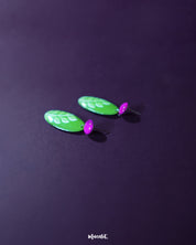 The Patbaan leaf drop earrings placed against a soft purple background, highlighting the delicate handcrafted detailing and natural leaf motif that brings an earthy elegance to any look — Muselot.