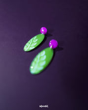 A zoomed-in view of the Patbaan drop earrings showcasing their intricate leaf-shaped design with fine cutwork and subtle metallic sheen, emphasizing their handcrafted charm and artisanal finish — Muselot