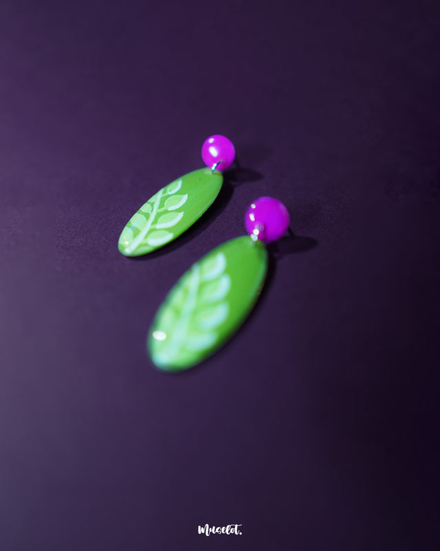 A zoomed-in view of the Patbaan drop earrings showcasing their intricate leaf-shaped design with fine cutwork and subtle metallic sheen, emphasizing their handcrafted charm and artisanal finish — Muselot