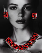 The model wearing Raktphool floral jewelry set, features delicate floral designs that add elegance and charm to any look, set against a rich background — Muselot.