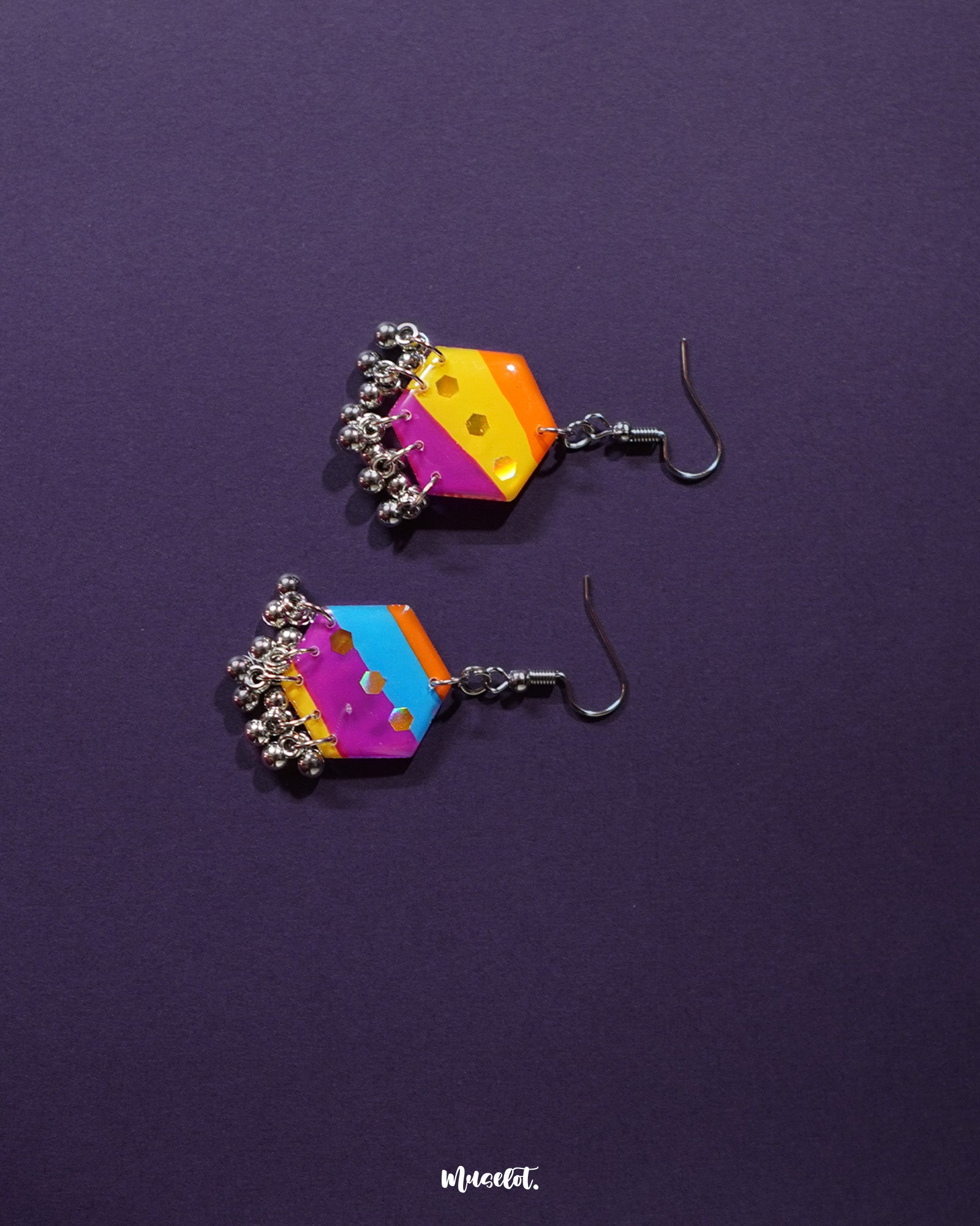the Rangbahaar colorful hook earrings, showcasing the vibrant multicolor hexagonal design with glinting sequin accents and delicate silver bead danglers that sway gracefully — Muselot