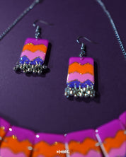 The Rangrezan handmade colorful necklace set features a striking blend of vibrant hues and detailed beadwork, making it a cheerful and eye-catching addition to festive and ethnic outfits — Muselot.