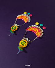 The Rangsiya colorful chandbali earrings are displayed against a soft backdrop, highlighting the blend of festive red, sunny yellow, and playful multicolor danglers, with pearl drops adding a touch of elegance — Muselot.