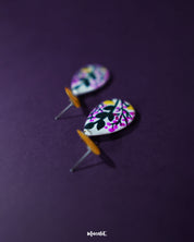 Raushanbahaar floral drop earrings in a teardrop shape, featuring delicate hand-painted blooms in pink and yellow with black detailing, highlighting festive charm and showcasing traditional craftsmanship with a modern twist — Muselot.
