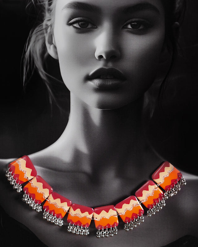 A model wearing the Sehrish handmade traditional necklace set, featuring detailed beadwork and vibrant colors that complement her ethnic outfit, capturing the elegance and cultural charm of the jewelry — Muselot.