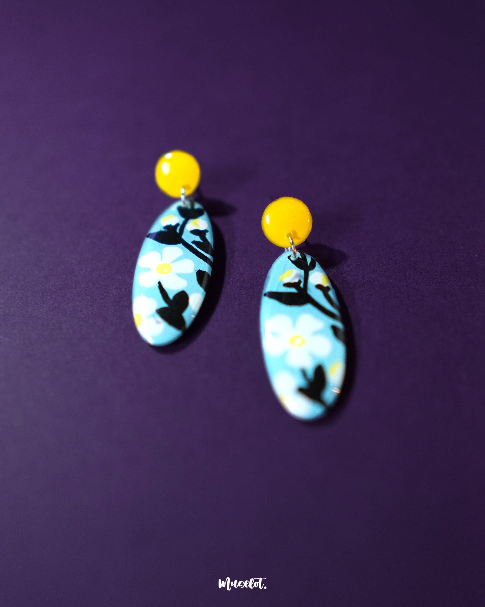 Shaamgul drop earrings displayed on a soft background, showcasing their handcrafted floral design with muted tones and intricate beadwork that reflects traditional charm — Muselot.
