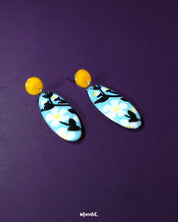 Shaamgul drop earrings captured from a side angle, highlighting their detailed petal structure and dangling beads that lend a graceful, bohemian appeal — Muselot.