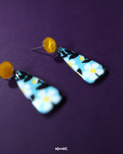 Shaamgul floral drop earrings displayed against a soft backdrop, showcasing the detailed floral design and dangling bead elements that add a graceful, handcrafted touch — Muselot.