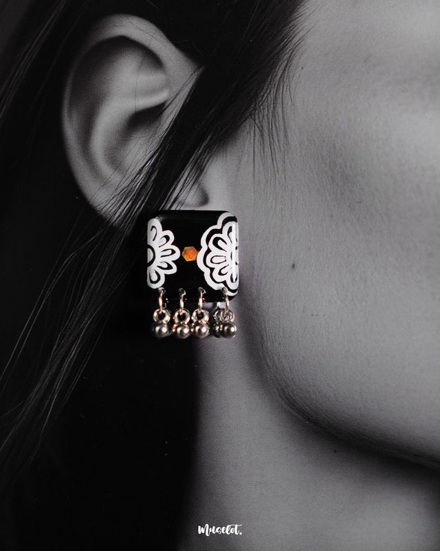 Shabnoor black floral earrings with delicately hand-painted petals and oxidized silver accents, showcasing a timeless fusion of elegance and folk artistry — Muselot.