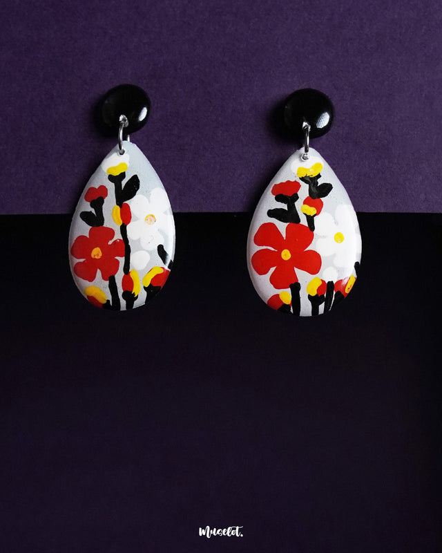 A striking pair of Shafaq drop earrings featuring a delicate blend of traditional design and contemporary elegance, adorned with intricate hand-painted details and subtle shimmer — Muselot