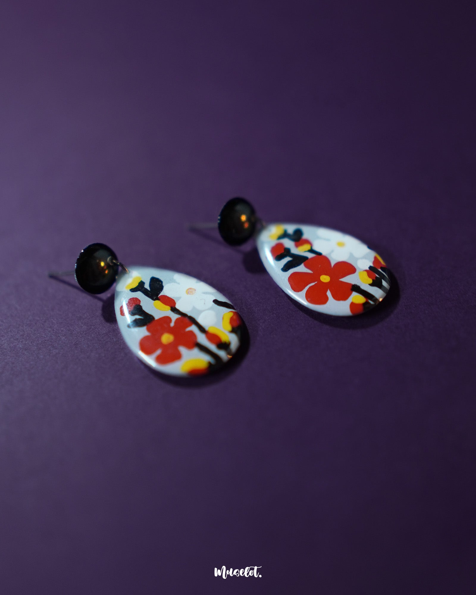 A front-facing shot of the Shafaq floral earrings displaying their symmetrical design and radiant floral accents, reflecting timeless charm and everyday elegance — Muselot