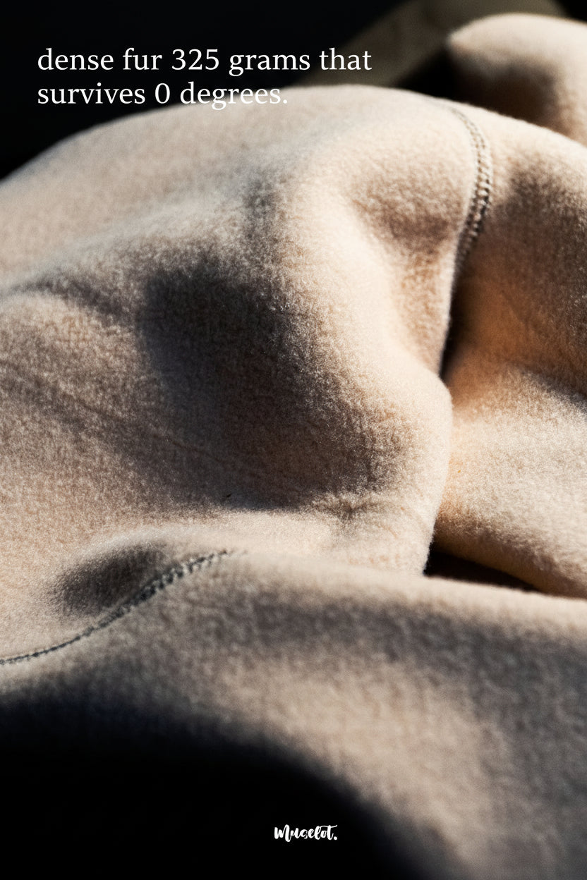 Close-up of beige furry tights, highlighting the soft and plush fabric texture, it showcases the material's warmth and coziness- Muselot