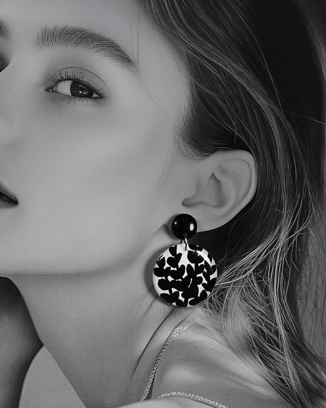 Close-up shot of a model wearing Siyahgul black earrings, where bold black tones and fine detailing create a statement look that balances elegance with contemporary flair — Muselot.
