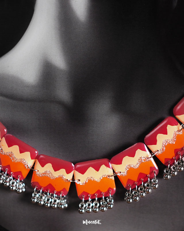 Close-up view of the Sehrish handmade traditional necklace set worn by the model, highlighting the intricate beadwork, vibrant colors, and fine craftsmanship that showcase its rich cultural heritage — Muselot