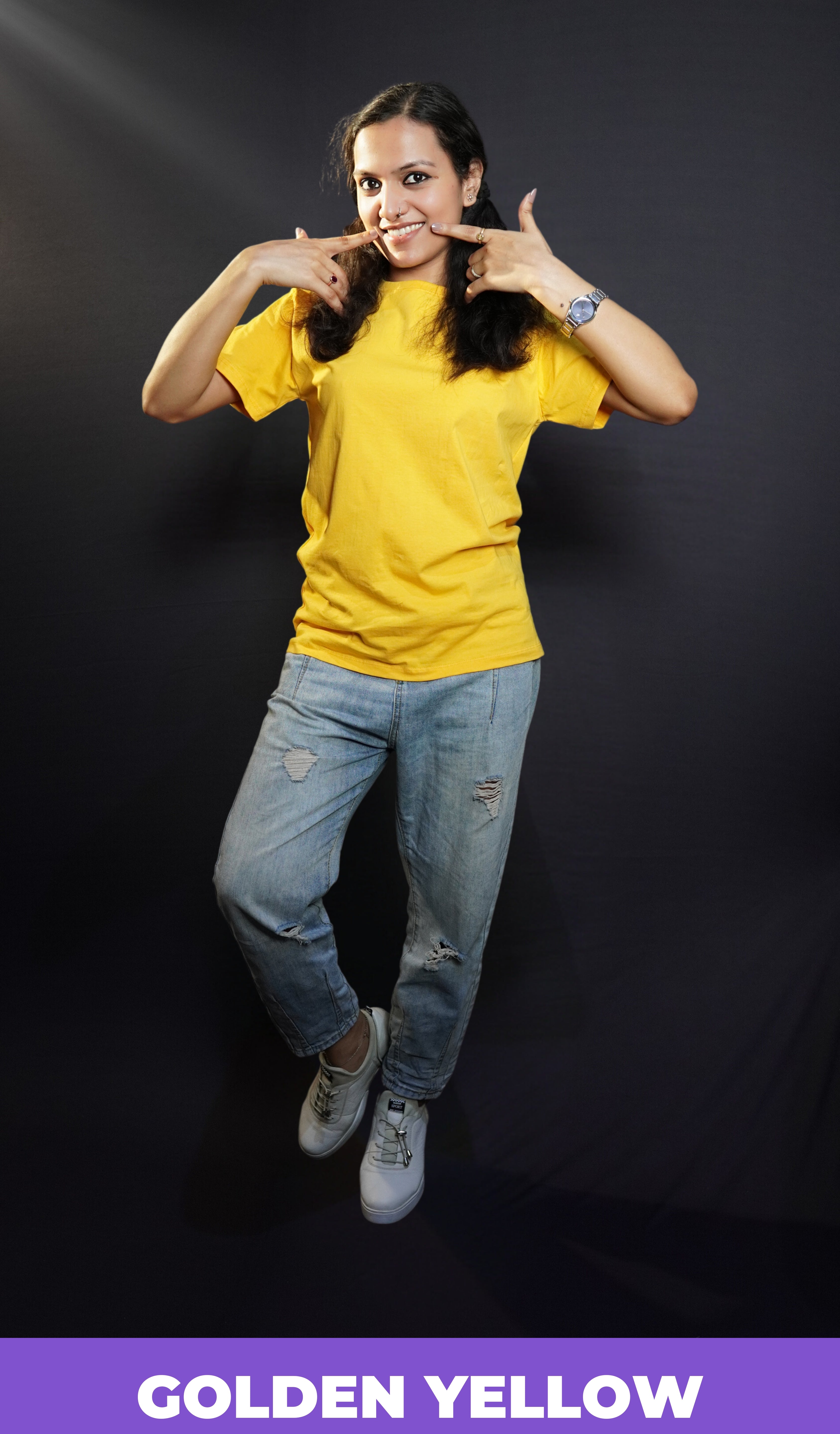 A stylish model wearing plain casual round neck T shirt posing against a dark background-Muselot