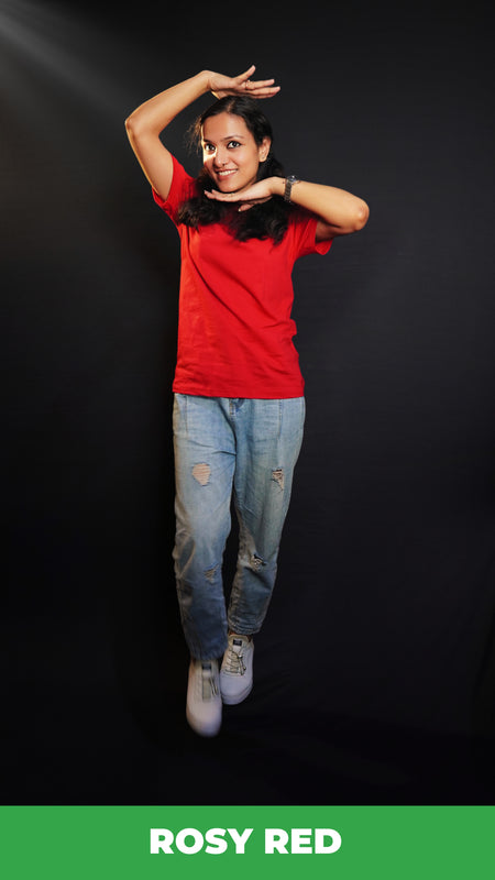 A woman wearing a girl's cotton short sleeved quick drying rosy red t-shirt, posing with her palms upon her head and under her chin, showcasing an informal snug fit-Muselot