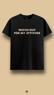 Black graphic t-shirt showcasing the “Watch Out for My Attitude” statement, boldly showcased against a clean beige background – Muselot