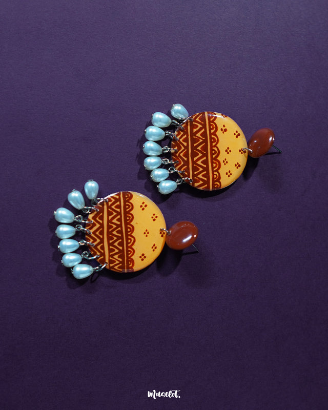 Zardozi traditional handmade earrings displayed on a soft surface, showcasing the intricate zardozi embroidery and highlighting their elegant ethnic design — Muselot.