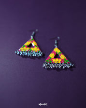 Zarmin triangle floral earrings with hand-painted yellow and pink blooms on a vivid red base, highlighting their unique triangular shape and showcasing the intricate silver jhumki drops that lend a traditional twist to a bold, artistic design — Muselot.