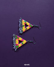 Zarmin triangle floral earrings shown laid flat against a soft background, highlighting the delicate floral patterns and triangular shape, with oxidized silver detailing and tiny jhumkis adding to their artisanal charm — Muselot.