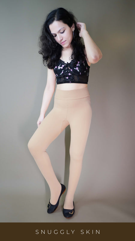 A model, wearing body-hugging skin-colored warm tights, showcasing their seamless fit that contours to the body while providing warmth and comfort. The skin tone color highlights a natural, versatile look -Muselot