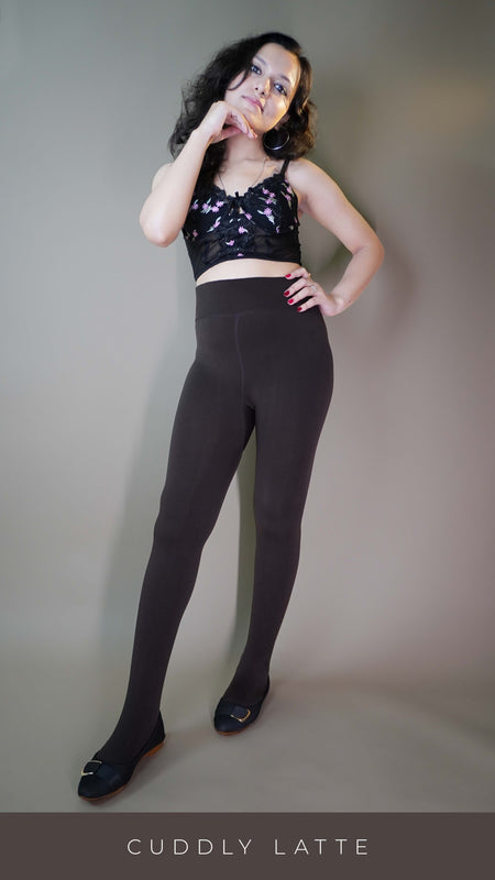 A model wearing comfy fur-lined dark brown warm tights, highlighting their plush, soft lining that provides extra warmth and comfort. The deep dark brown color adds a rich, cozy touch, making these tights both practical and stylish for chilly weather. -Muselot