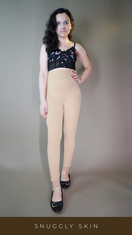 A model, wearing comfy fur-lined skin warm tights, highlighting their plush, insulating fabric that provides extra warmth and comfort. The skin tone adds a natural, seamless look, while the fur lining ensures a cozy, stylish fit. -Muselot
