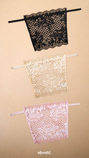 Three lace clip-on neckline covers in black, beige and light pink displayed on a beige background, featuring delicate floral lace detailing and adjustable straps. Designed to provide elegant coverage for deep neck tops, dresses and blouses, these lightweight mock camisole inserts add a feminine layered look while helping customize neckline coverage with comfort and style – Muselot