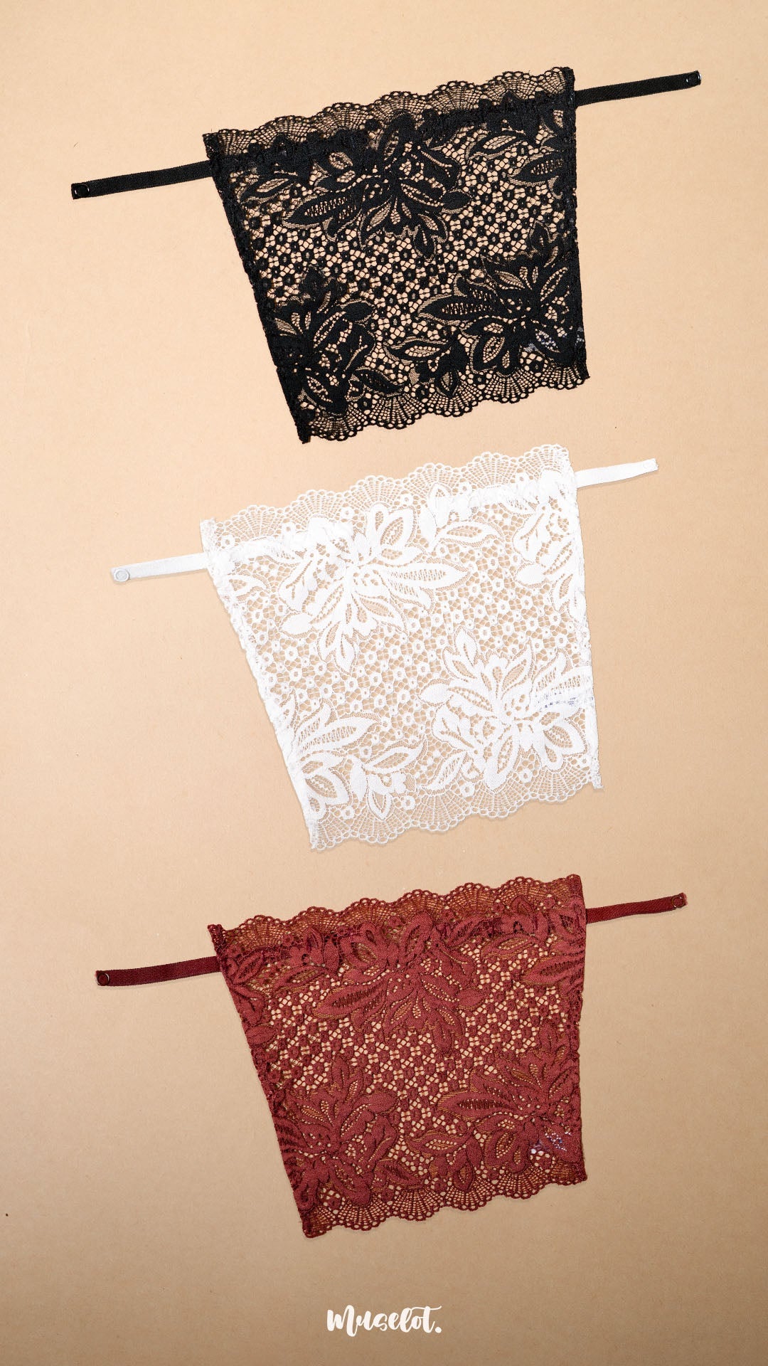 Three floral lace deep neck cover-up camisoles in black, white and burgundy displayed on a beige background, showcasing elegant colour combinations, intricate lace craftsmanship and versatile styling options for dresses, tops, blouses and low-neck outfits – Muselot