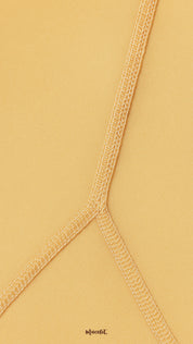 Close-up of double-stitched seam on skin colored tights, highlighting reinforced durability, premium stretch, and secure finish - Muselot