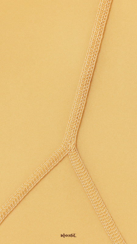 Close-up of double-stitched seam on skin colored tights, highlighting reinforced durability, premium stretch, and secure finish - Muselot