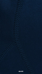 A close-up of navy blue opaque tights featuring strong double-stitched seams, highlighting durability, reinforced design, and premium quality finish - Muselot