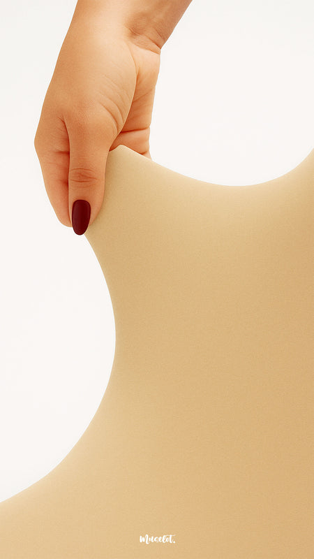 A hand stretching durable beige semi-opaque stockings, showcasing tear-proof strength, elasticity, and premium quality fabric - Muselot