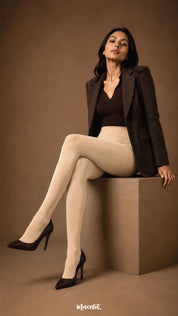 A seated view of skin colour winter stockings with full closed feet, high waist and warm opaque leg coverage - Muselot