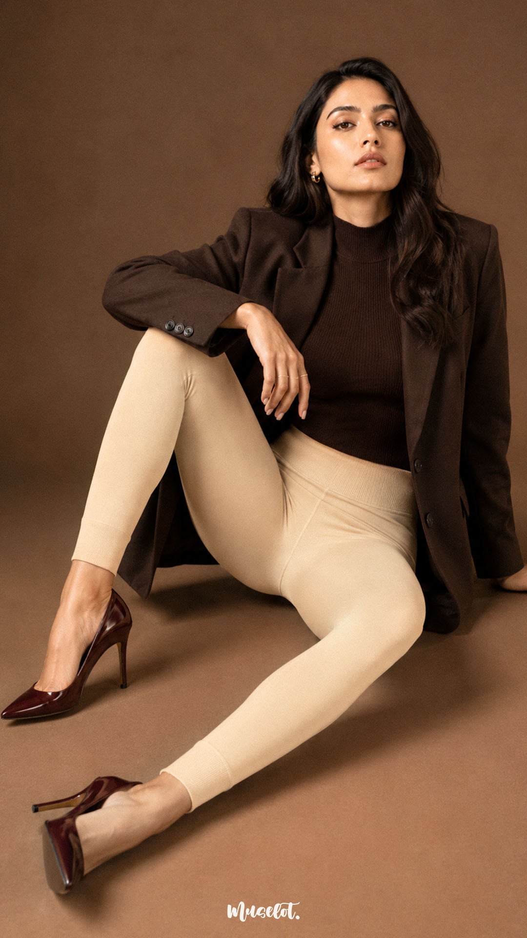 A woman seated in beige fleece lined open-foot tights with high waist, opaque winter coverage and ribbed ankle cuffs - Muselot