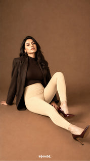 A woman wearing beige thermal stockings with open feet, full-leg opaque coverage and fitted ankle-length finish - Muselot