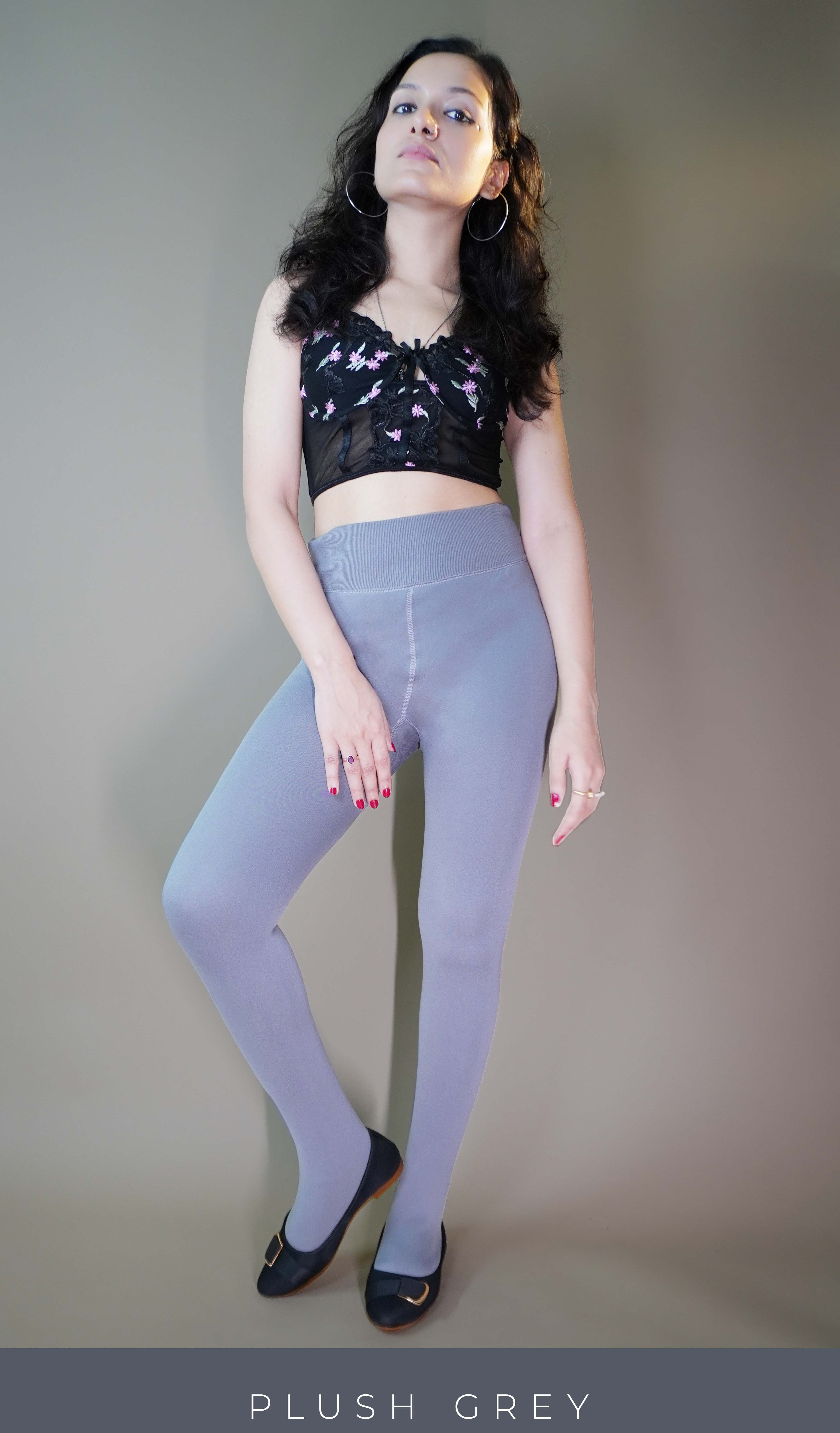 A model, wearing fur-lined grey warm stockings, showcasing their soft, insulating fabric that provides extra warmth and comfort. The grey color highlights a sleek, cozy design, making these stockings both stylish and practical for colder weather. -Muselot