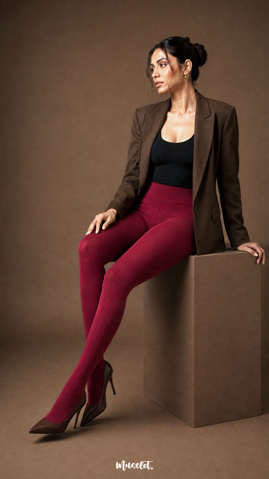 A woman seated in maroon fur lined stockings with full closed-foot coverage, high waist and opaque winter finish - Muselot