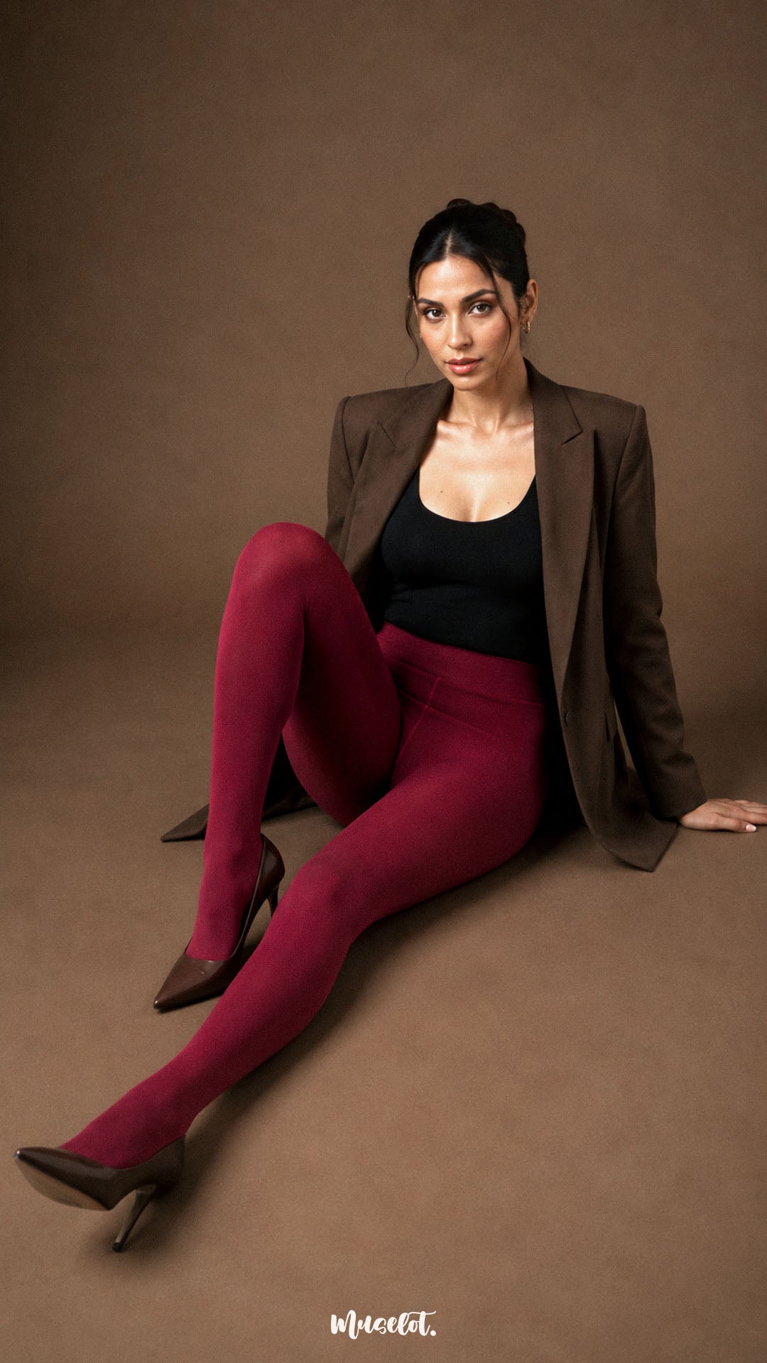 A woman wearing maroon fur lined winter tights with closed feet, smooth full-leg coverage and high waist styling - Muselot