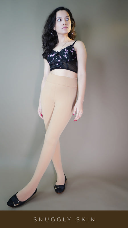 A model, wearing fur-lined skin tights, showcasing the soft, plush lining that provides added warmth and comfort. The skin color highlighting a seamless, natural look, making these tights both stylish and cozy for colder days. -Muselot