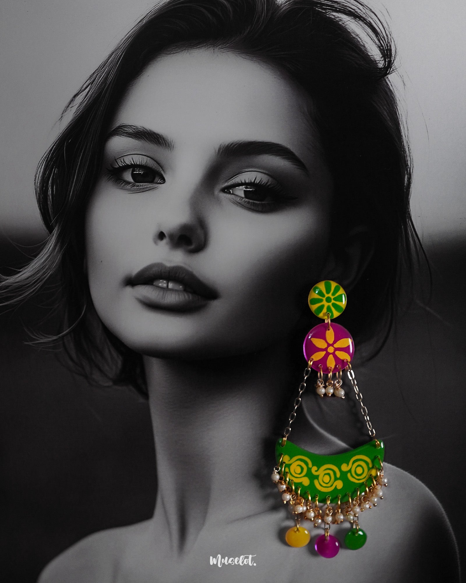A woman wearing handcrafted chandbali earrings with vibrant motifs and playful accents, highlighting cultural flair and showcasing a joyful blend of tradition and creativity — Muselot.