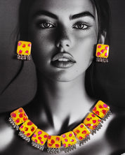 Model wearing hand-painted jewelry set, showcasing yellow square tiles with pink-red floral accents and silver ghungroo trimming for a vibrant traditional look – Muselot.