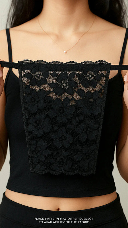 Close-up of model holding Lacy Black Mockers, showcasing the intricate lace pattern and refined design for effortlessly styling deep-neck outfits – Muselot.