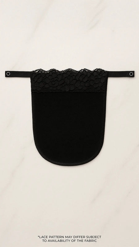 Black lace mocker modesty panel in flatlay view, showing intricate lace pattern and secure clip design for deep-neck coverage — Muselot.