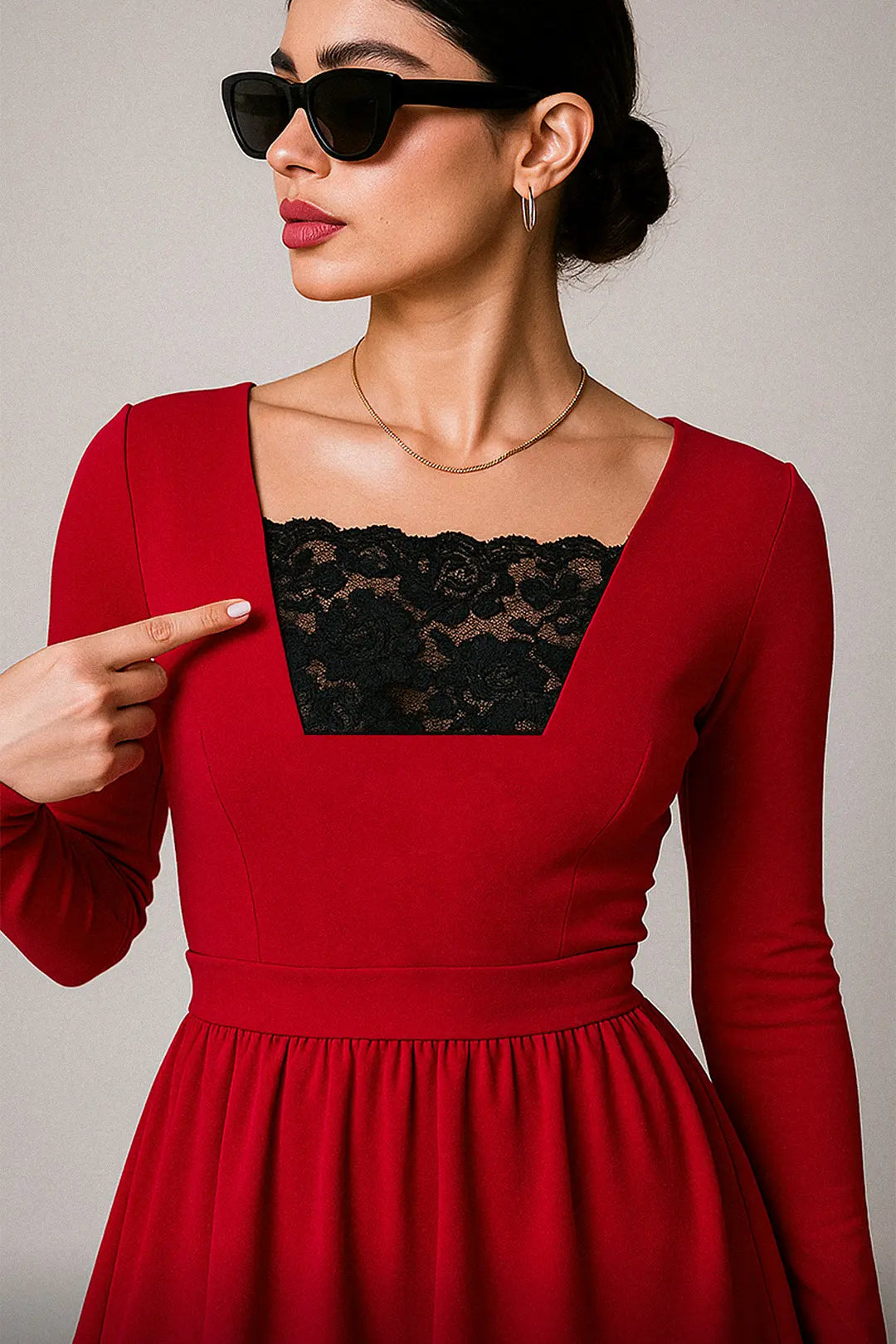Model wearing Lacy Black Mockers with a red dress, showcasing the delicate lace detail and striking contrast that enhances deep-neck outfits – Muselot.
