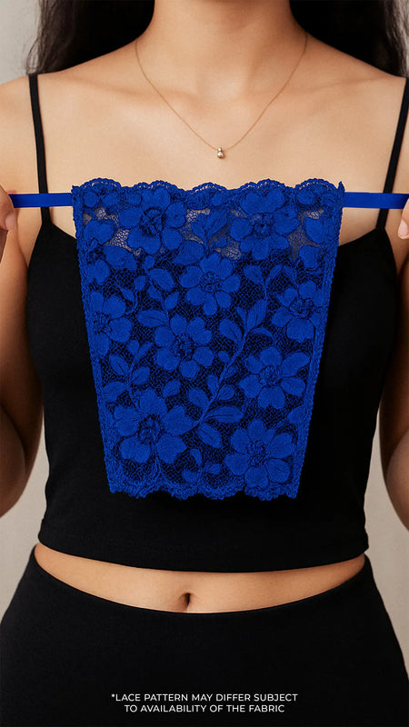Close-up of model holding Lacy Royal Blue Mockers, showcasing the bold lace texture and rich color that elevates deep-neck outfits – Muselot.