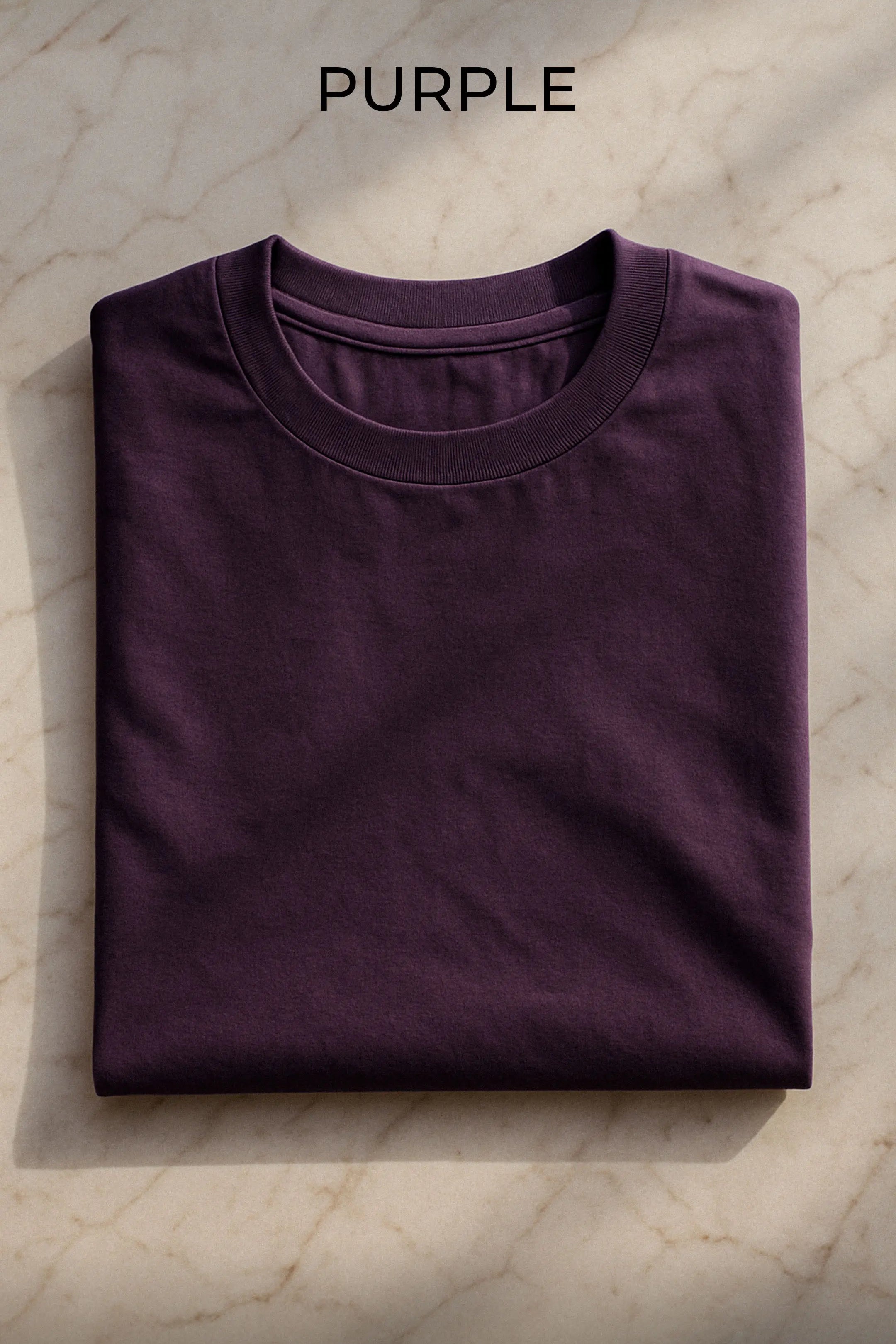 muselot-oversized-tshirt-purple-folded-flatlay.webp